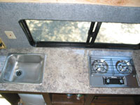The sink and stove installed in the counter top