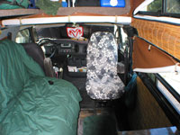 The current van set up in the front with the captains chair turned around